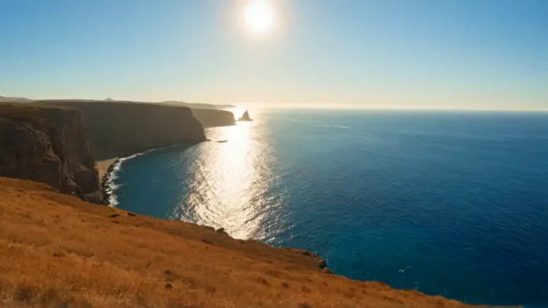 Una figura contempla el mar al atardecer